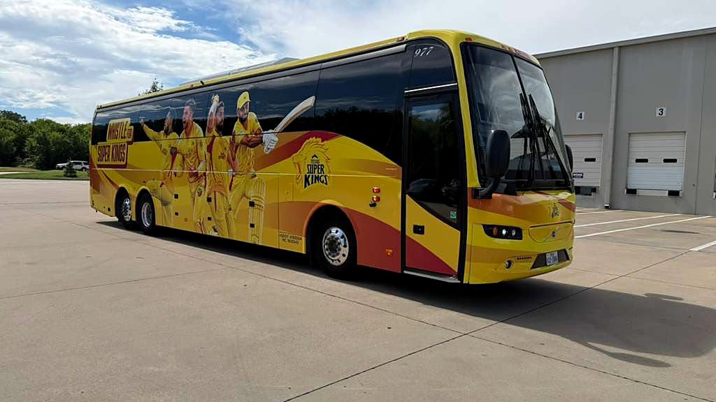 Volvo touring coach used for Major League Cricket team transport, front three-quarter view showing the boarding door