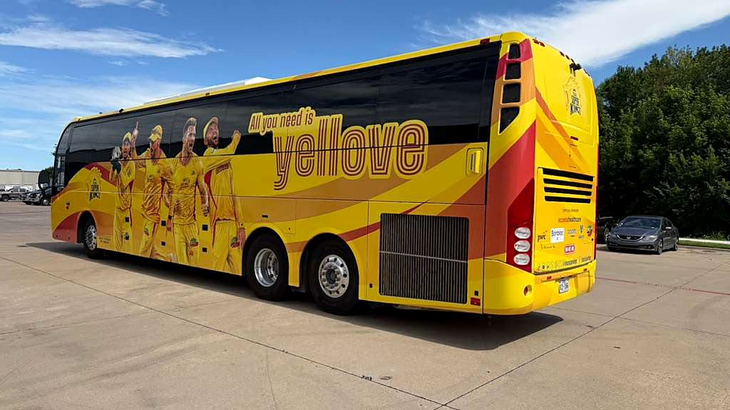 Rear panel of the MLC team coach carrying franchise and sponsor branding