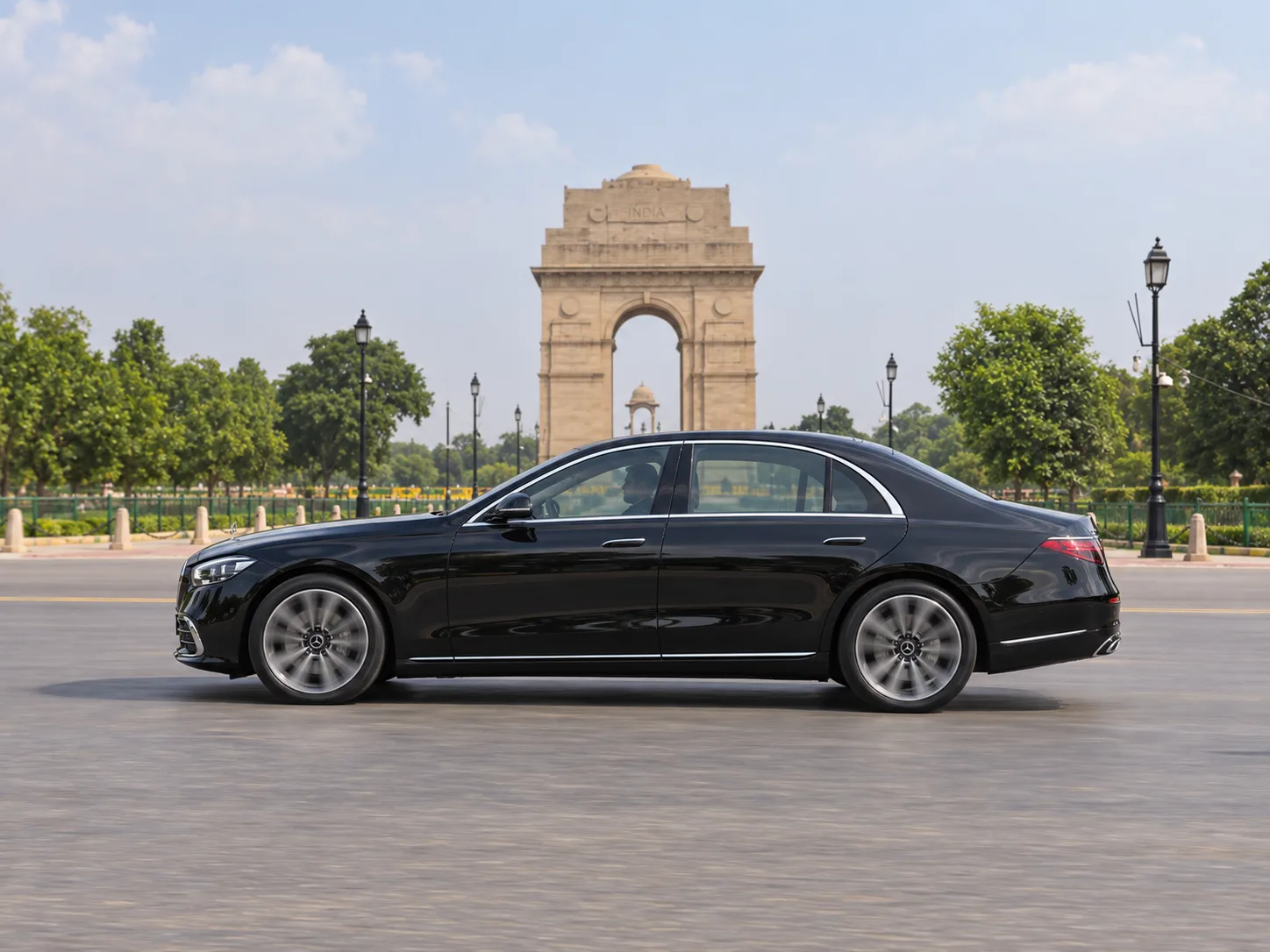 Chauffeur-driven black Mercedes S-Class at India Gate, New Delhi - luxury car rental in India by KTC